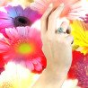 Hand and Flowers wearing PAraiba Tourmaline